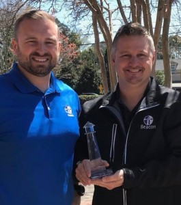 David Dees (Beacon, left) presents Jason Carver (Owner, Total Pro Roofing, right) with the 2018 Lighthouse Award